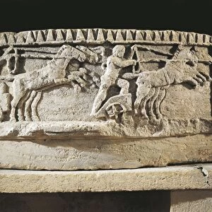 Architectural fragment representing a winged genius guiding a chariot on the circus racecourse