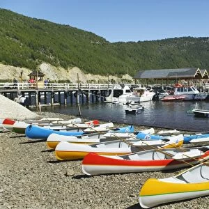 Argentina, San Martin de Los Andes, Lago Lacar, canoes and boats on the beach and in the lake
