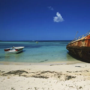 Caribbean, Dominican Republic, Southwest, Parque Nacional Jaragua, Playa Cabo Rojo, rusting hull of boat on beach