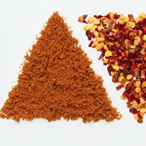 Cayenne pepper, chili flakes and paprika shaped into triangles