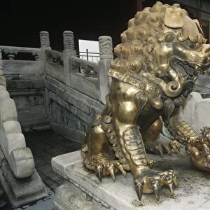 China, Beijing, Forbidden City, Gu Gong, Gilded bronze lion sculpture at Gate of Celestial Purity, Quianquing