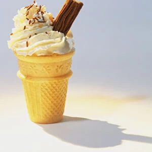 Flat-based ice cream cone with piped ice cream and a chocolate flake