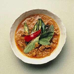 Geng panaeng neua, red curry with beef, peanuts, Thai basil and chilli peppers