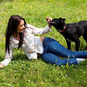 Girl Playing with Her Dog