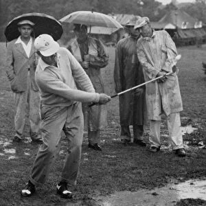 Golfer Playing In The Rain