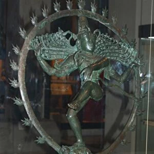 Hindu god Shiva appears as Nataraja (lord of the dance) dancing in a ring of fire