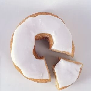 Iced doughnut with slice removed