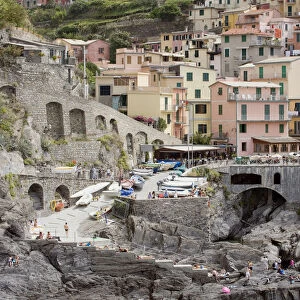 Italy, Liguria, Cinque Terre, Manarola, view of rocky beach and houses