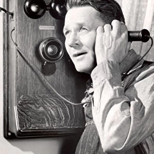 Portrait of a man using a telephone