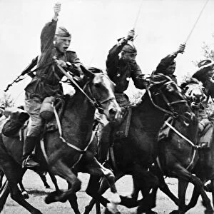 Red army cavalry charge with sabers drawn, following the tanks into the action, world war ll