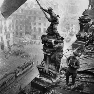 Red army soldiers raising the soviet flag over the reichstag in berlin, germany, april 30, 1945, photo taken by vladimir grebnev