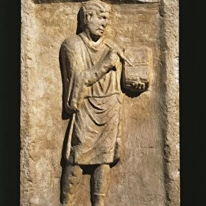 Relief with a young man writing on a tablet from Moderndorf, Austria, Roman civilization