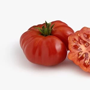 Whole and sliced Italian Costoluto Fiorentino tomatoes