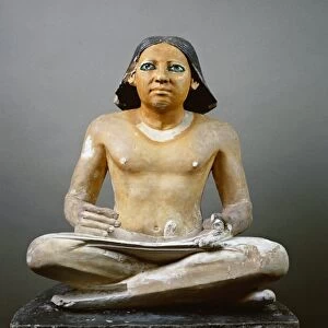 Statue of a seated scribe with papyrus, painted limestone from Saqqara, circa 2475 b. c