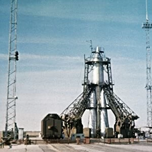 Vostok rocket carrying the sputnik 1 satellite on the launch pad in 1957, this is a still from a soviet film of the launch