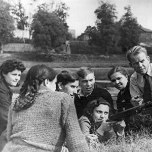 World war 2, george glazkov (right) on the spartak team teaches the youth to handle machine guns and anti-tank rifles