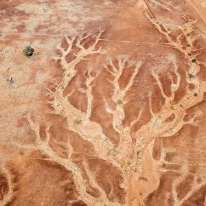 Aerial viewpoint looking down on the dry river beds and cracked earth of outback Australia