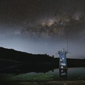Milky Way over the intake tower in Gold Creek Reservoir in Upper Brookfield, Brisbane, Australia