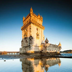 Belem tower reflected into water, Lisbon, Portugal