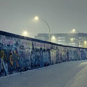 Berlin wall at winter with mist an nightlights