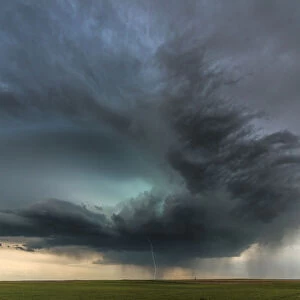 Dramatic looking super-cell storm cloud with cloud to ground lightning. Colorado. USA