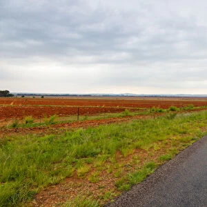 The flat landscape and very red soil farmlands of the Free state, very near to Parys