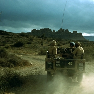 Members of the British army driving through Aden