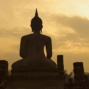 Silhouette of buddha statue at sunset, Thailand