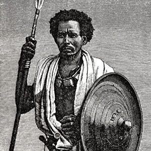 Somali man of Danakil, standing, holding spear and shield