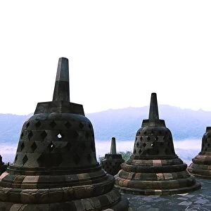 Stupas with background of mountains at Borobudur