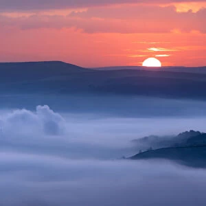 Sunrise over a foggy Castleton, English Peak District. UK
