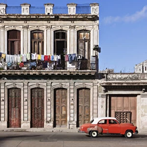 Vintage car driving on Havana street, Havana, Cuba
