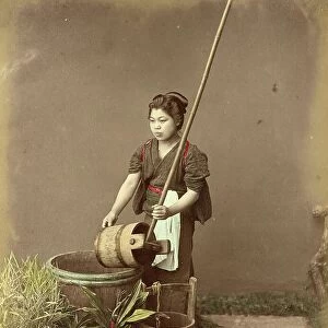 Woman drawing water from a well, c. 1870, Japan, Historic, digitally restored reproduction from an original of the period