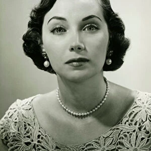 Woman in lace dress posing in studio, (B&W), (Close-up), (Portrait)