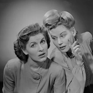 Two women talking indoors