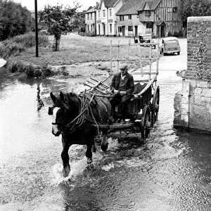 Old man driving through the ford at Eynsford in a horse and cart. Between the wars
