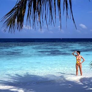 TROPICAL ISLANDS - Maldives Bandos, with girl of beach