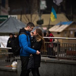A couple stands on Independence square in Kiev, on February 14, 2014