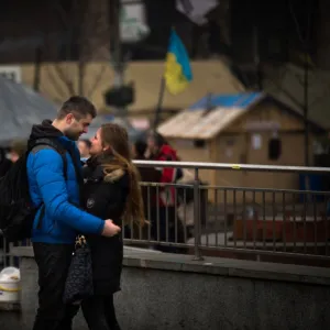 A couple stands on Independence square in Kiev, on February 14, 2014