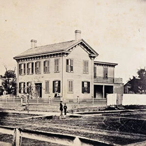 Abraham Lincoln posing before his Springfield, Massachusetts Home, c
