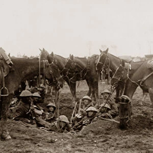 Cavalrymen resting in a shell hole (b / w photo)