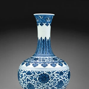 A Chinese porcelain bottle vase painted with scrolling stylized flowers in underglaze