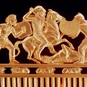 Comb ornamented with warriors in combat, five crouching lions below (gold