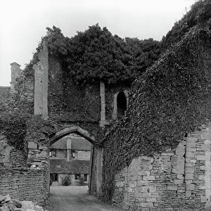 Entrance to the gatehouse, Beverston Castle, from Country Houses of the Cotswolds (b/w photo)