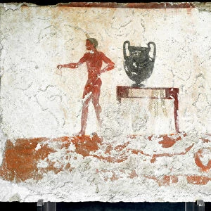 Etruscan art: a young naked ephebe near a table where a vase is placed