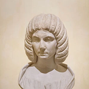 Female portrait featuring an imposing hairdressing typical of the Severian family between 200 and 210 AD (marble)