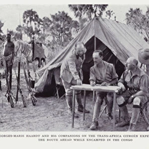 Georges-Marie Haardt and his companions on the Trans-Africa Citroen Expedition study the route ahead while encamped in the Congo (b / w photo)