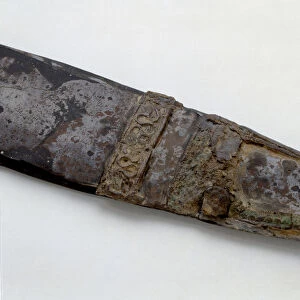Detail of iron spade with bronze slats. From tomb 394 of Epiais-Rhus