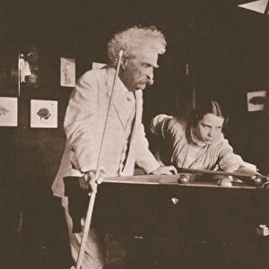 Mark Twain playing pool with the daughter of his biographer Albert Bigelow Paine