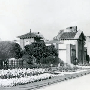 The Reptile House at London Zoo in 1928 with formal flower beds along the paths to